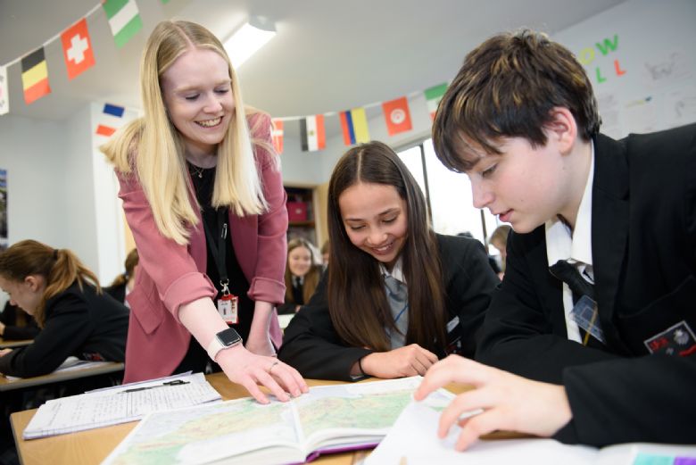 Pupils learning with teacher